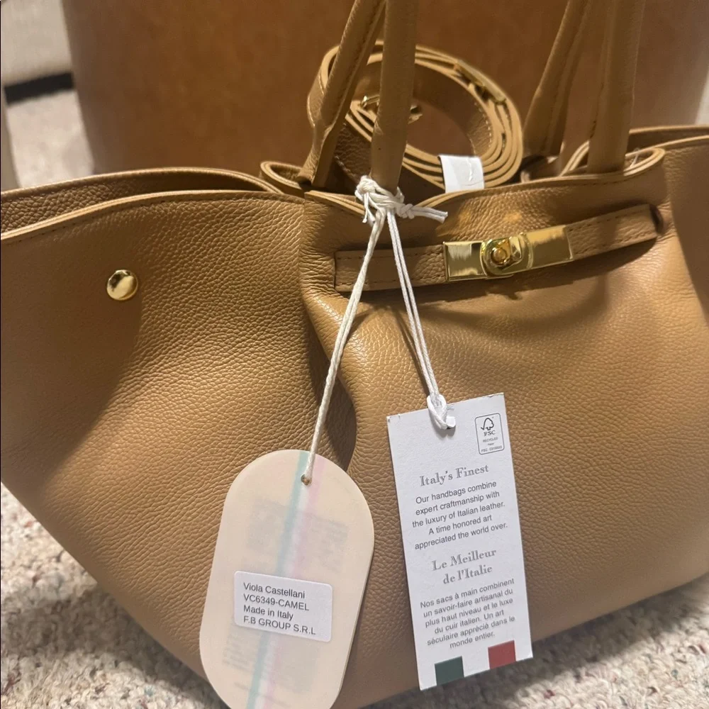 Viola Castellani. Tan leather tote bag with gold hardware. Adjustable strap.